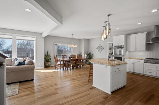 Experience seamless entertaining in this thought-out designed space, where a spacious kitchen flows effortlessly into the dining and living areas