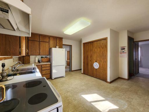 Kitchen is spacious and features main floor laundry.