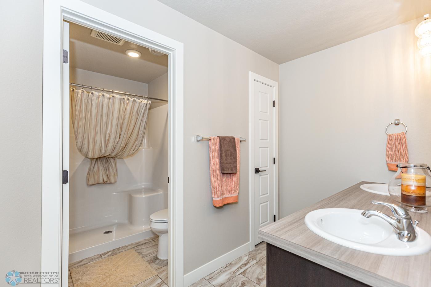 Bathroom 3 - basement | dual sinks, separate areas for sinks and shower/stool