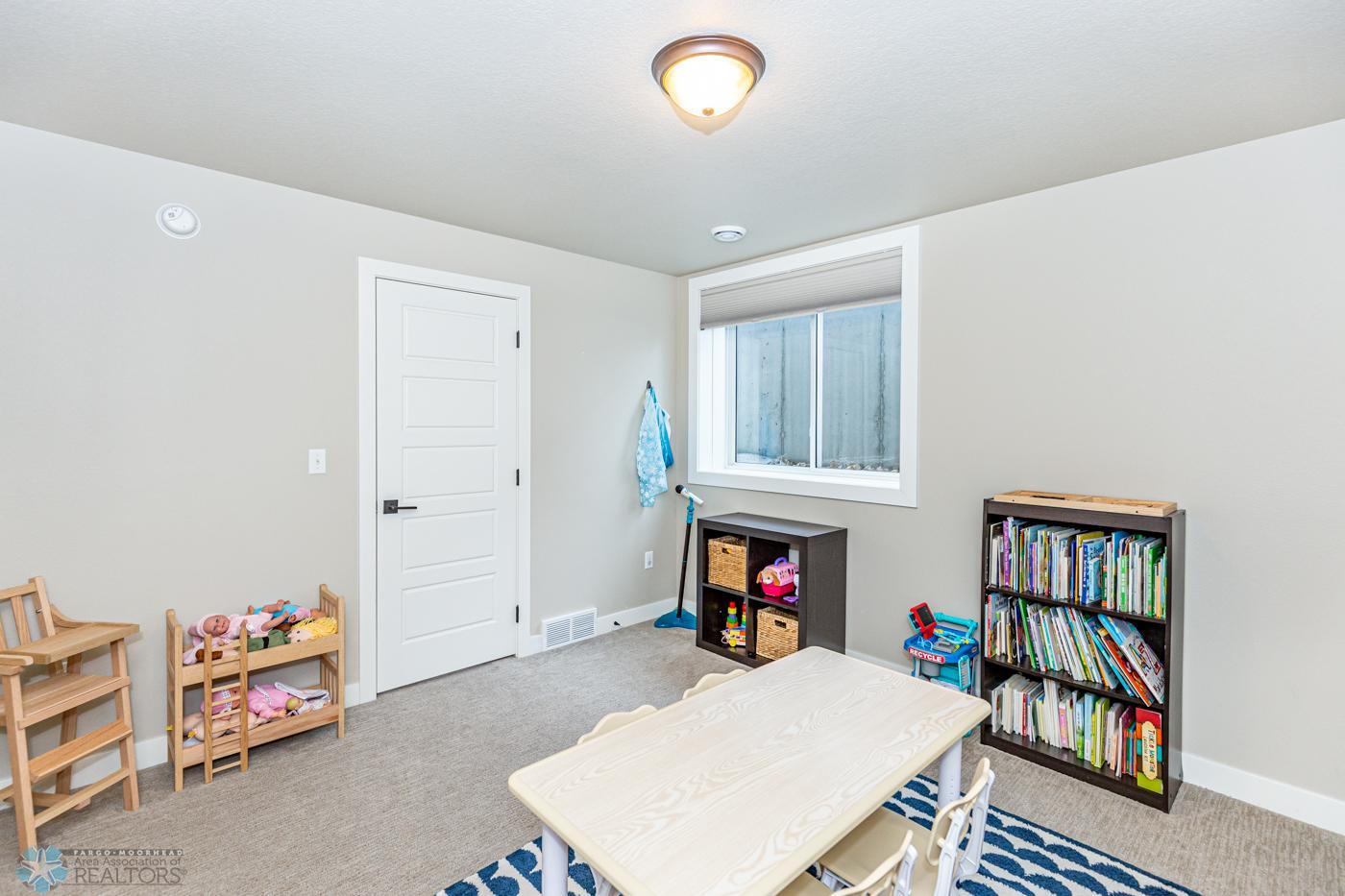 Bedroom 6 - basement | shown here as a playroom. Has a walk-in closet.