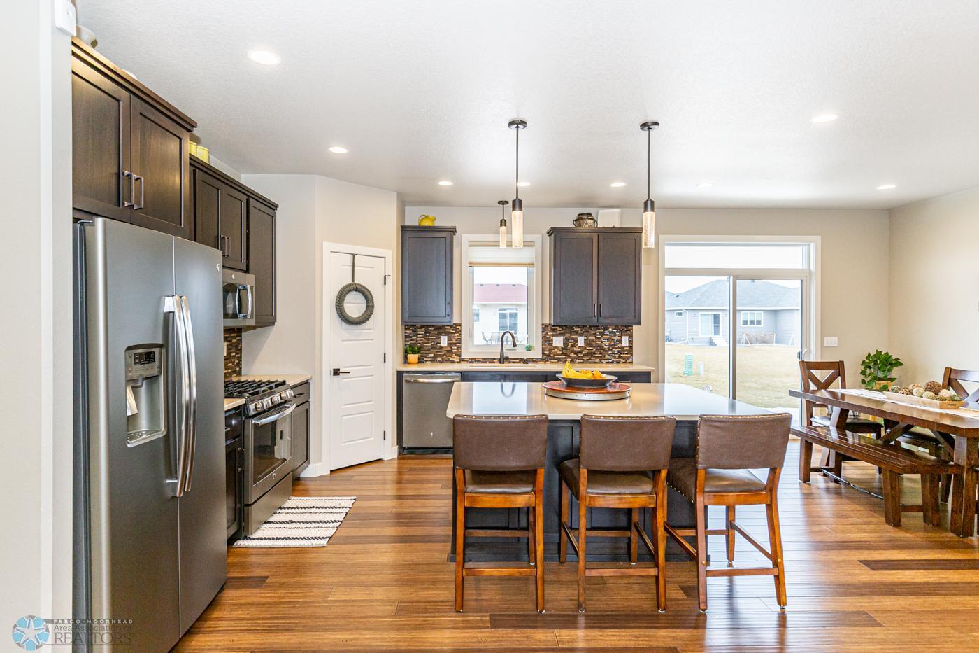 Kitchen | Gas range, pantry, Quartz tops, window to back yard