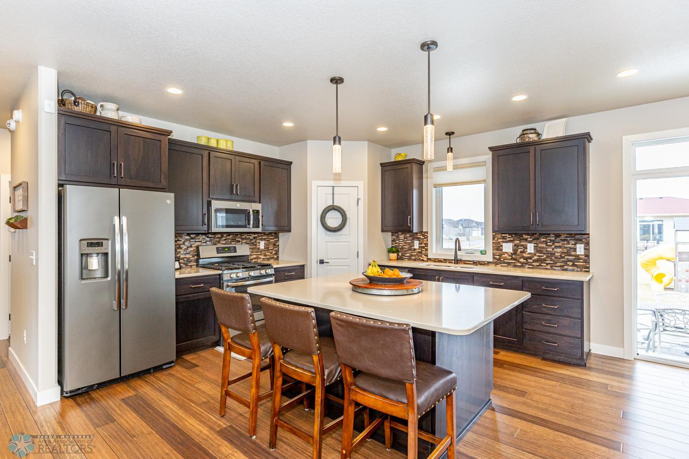 Kitchen | Gas range, pantry, Quartz tops, window to back yard