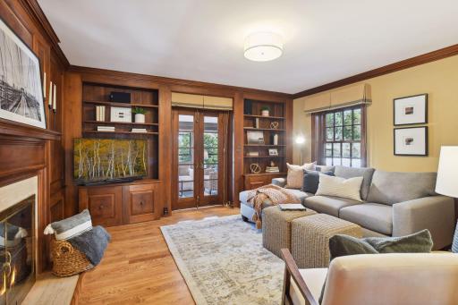 Gorgeous, burled, walnut paneling and built-in's add to the ambiance of the main floor den