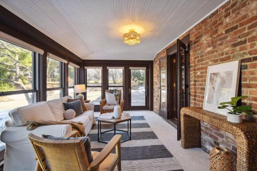Exposed brick and bead-board ceiling add to the character of this room