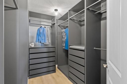Primary custom closet system that provides TONS of storage and organization!