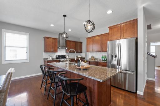 Kitchen - stainless steel appliances throughout, new dishwasher 2023, gas range, and tons of cabinets + countertop space!