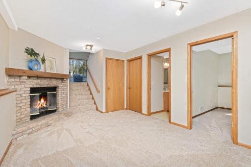 Retreat down to the lower level family room and cozy up next to the wood burning fire place!