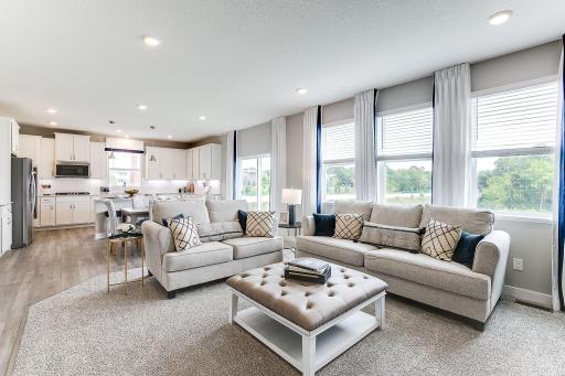 An open layout makes this main floor perfect for both entertaining and everyday living! *Photo of model home, same floor plan; colors and options may vary.