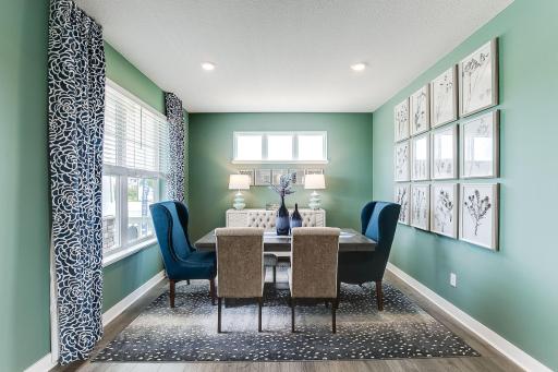 You'll find this flex room just steps from the foyer. Decorated as a formal dining in this model home, you can use to the space how it best suits you. Home office, playroom, piano, you name it! *photo of model home
