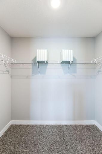 One of two walk-in closets in the primary suite! Yes, TWO! *Photo of model home, same floor plan; colors and options may vary.