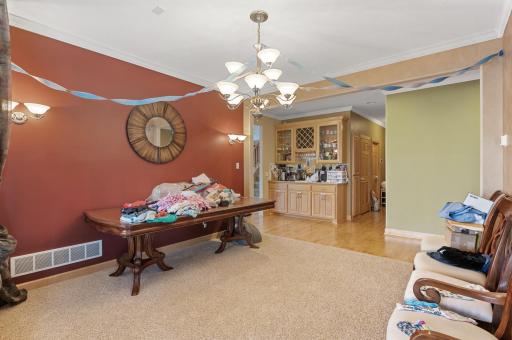 Host gatherings in the formal dining room, complete with generous space and a built-in wet bar nearby, or enjoy casual meals in the adjoining informal dining space boasting bay window views of the backyard oasis.