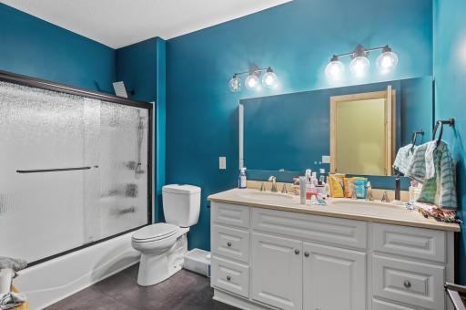 Only steps away from the full shared bathroom with tub/shower combo and dual sinks.