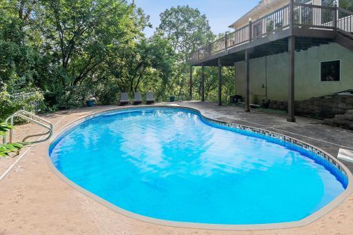 Embrace outdoor living with a private backyard pool and a spacious deck, perfect for soaking up the Minnesota summers and hosting gatherings.