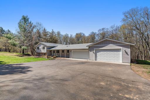 Updated country home with 4 car garage & asphalt driveway