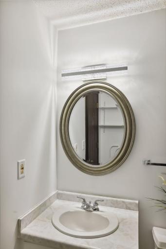 Fresh paint, new mirror and new light fixture in the hallway full bathroom