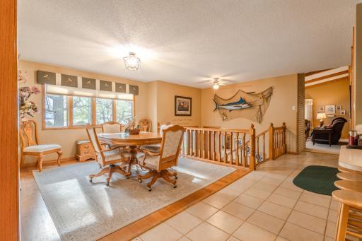 The dining room has a beautiful view out to the lake. The home has Anderson windows; the window glass was replaced in 2003.