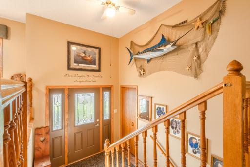 A nice large Foyer leading to the front Aggregate patio to watch those sunsets