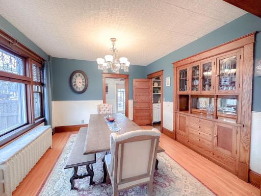 Dining Room has built-in buffet, original light fixture and stained glass window