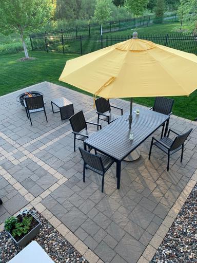 Tasteful details highlight the two toned, paver patio
