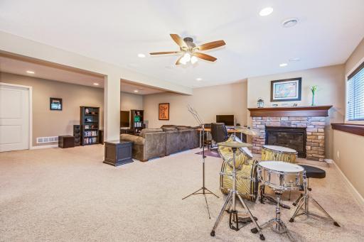 Lower-level Family room and recreational areas, compete with Home Theater system, and gas, stone surround, fireplace.