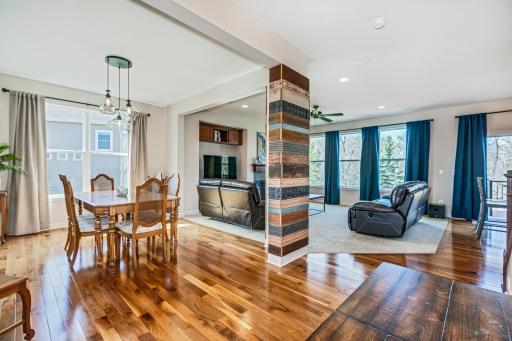 Gleaming, walnut, hardwood floors grace the majority of the main level of the home. Open and Airy, this level provides a space that offers great natural light., views of the meticulously manicured rear yard spaces and community walking paths .