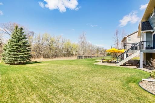 Lush and plentiful, this yard is perfect for whiffle ball, volleyball, soccer, or even a swing set.
