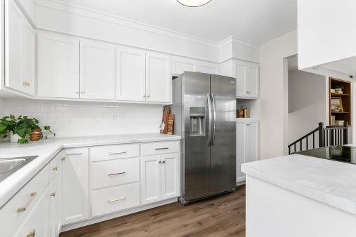 White cabinets illuminate this newly remodeled kitchen.
