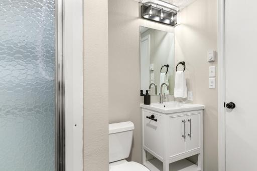 Even in a smaller space, this 3/4 bathroom exudes sophistication and comfort.