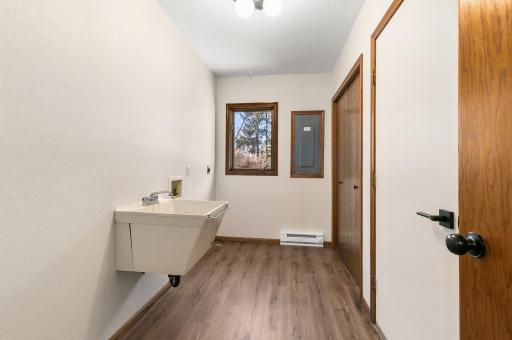This laundry room combines practicality with style for an efficient and attractive space.