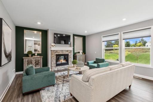 Cozy and contemporary, the main level great room features a stunning gas fireplace with stone surround.