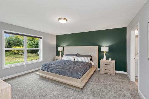Find your retreat in this stunning primary bedroom. Enjoy the exclusivity of a private bath and huge walk-in closet.