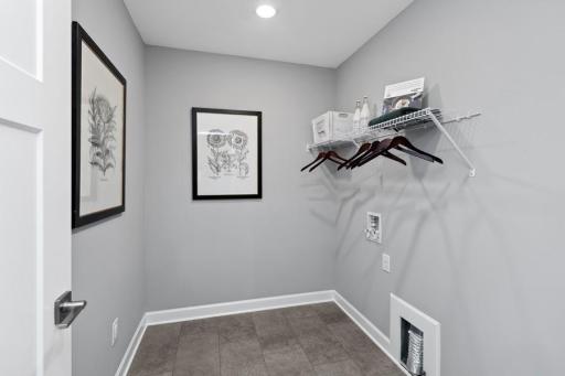 Centrally located on the upper level, along with the four bedrooms, this laundry room is sure to provide the ultimate convenience. Appliances are not included.