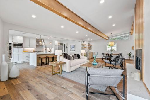 White oak engineered hardwood flooring & open layout from kitchen