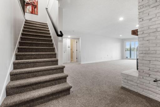 Staircase leading to the Lower Level w/ new carpet!