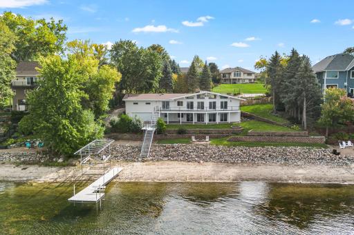 Fantastic opportunity to reside on 150 feet of Lower Prior lakefront in a totally renovated walkout rambler!