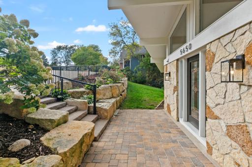 Beautiful landscape welcomes you to 5650 Fairlawn Shores Trail