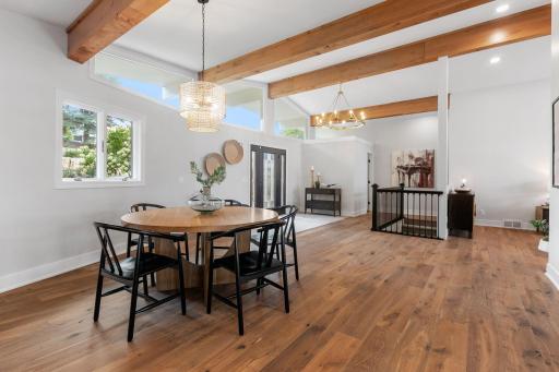Vaulted ceilings with exposed beams wrapped in rustic alder