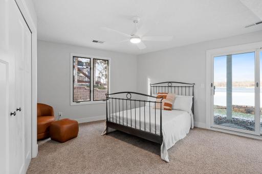 Bedroom 2 w/ patio door access to property & beach!