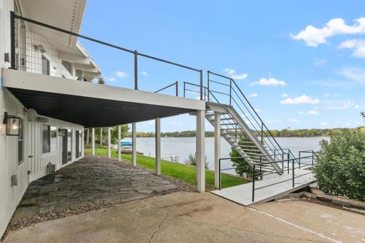 Metal staircase with access to the lake and the lower driveway