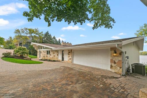 Concrete paver driveway leading to the garage