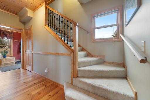 Beautiful staircase that leads you up to your master bedroom, guest room, full bathroom and laundry.