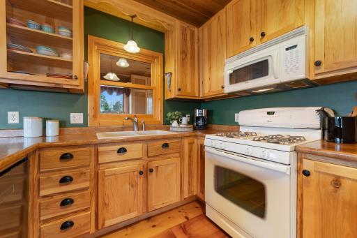 Custom hickory cabinets elevate the feel of your fully functioning kitchen