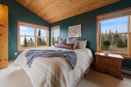 This Master bedroom is sure to be your new sanctuary. Waking up to views of Lake Superior and nature is a dream come true!