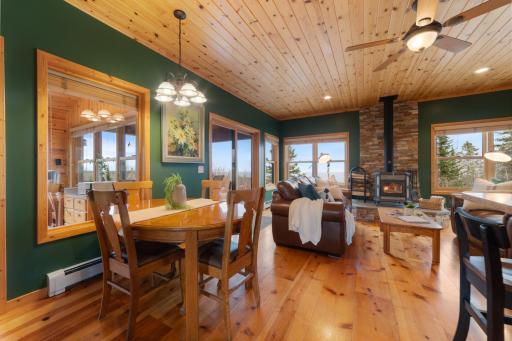 Expansive windows that bring nature inside the home. Access through sliding glass door will take you right out to your deck. Perfect for early morning coffee