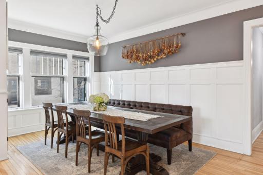 Wainscotting wall and built-in buffet add tons of charm in the dining room
