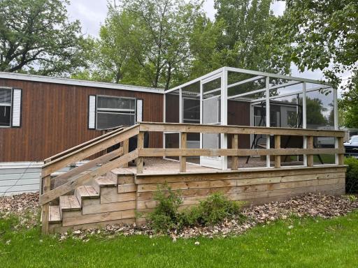 Brand new deck, 3 season porch with removable roof panels- just waiting for you to enjoy!.jpg