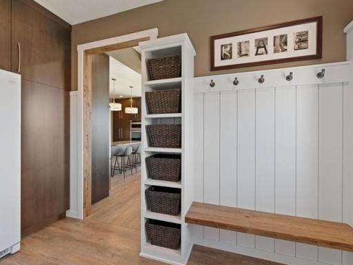 Entry with built in bench, storage, and cabinets