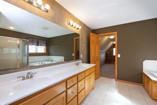 The private primary bathroom has dual sinks and awesome heated floors!