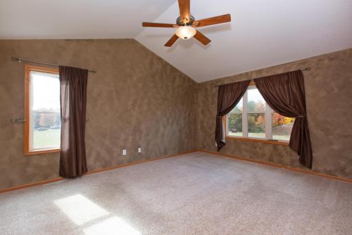 Primary upper level bedroom with vaulted ceilings and great views!