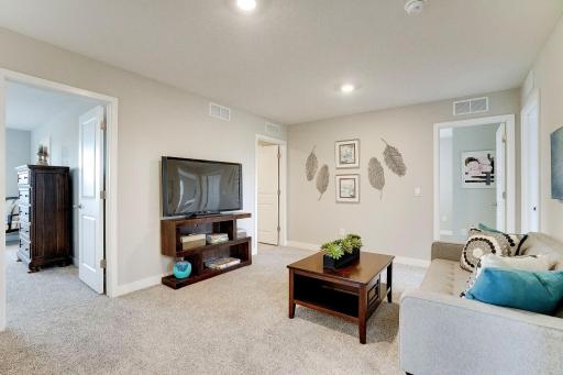 Once upstairs, the entire level flows from the focal point offered by this huge loft space. Sure to become a family favorite, the room is just steps from each of the home's Four upper level bedrooms! Photo of model, colors & options will vary.